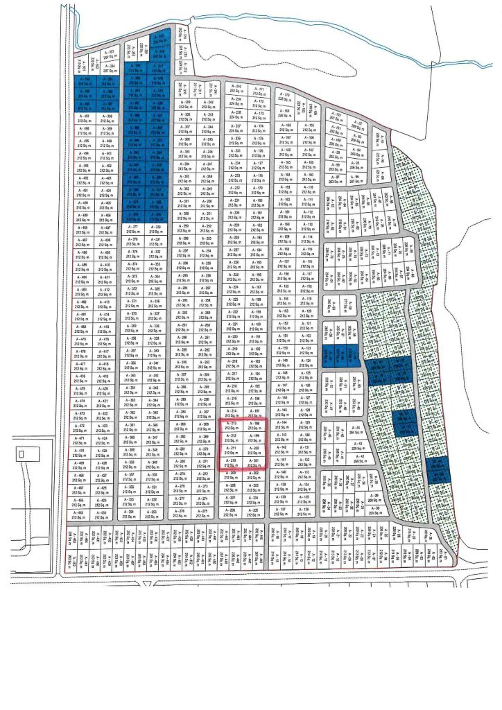 A detailed grid map showing parcels of premodernity agricultural land. Dark blue and green shaded areas mark specific plots, with a red-outlined area centrally located among unshaded sections. Roads border and intersect the grid, featuring a river at the top right corner. Available for sale by Auction with World of Auctions at Long Reach Ockham.
